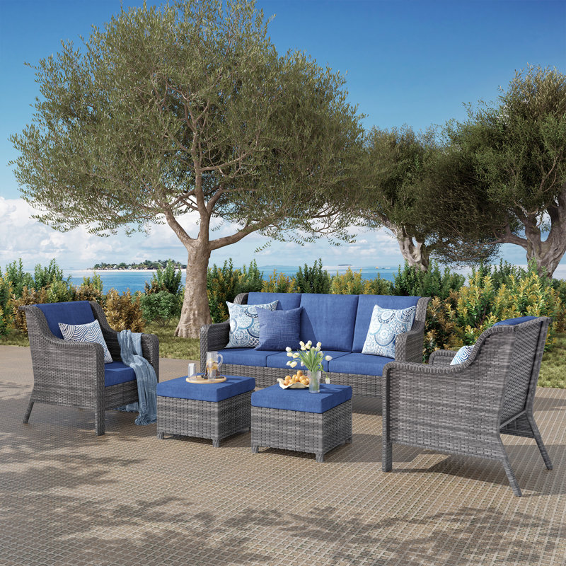 A Three-Seater Sofa + Two Armchairs + Two Footstools