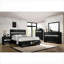 Grand lit plateforme avec rangement en bois massif noir pour la chambre principale, prêt pour les matelas
