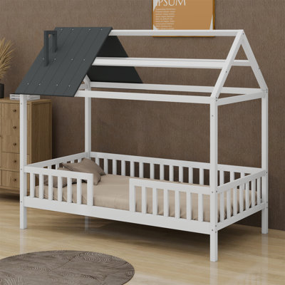 Lit en bois avec clôture