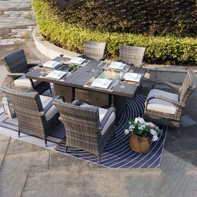 Cademon 6 - Person Wicker Patio Dining Set with Rectangular Table , Cushions Included
