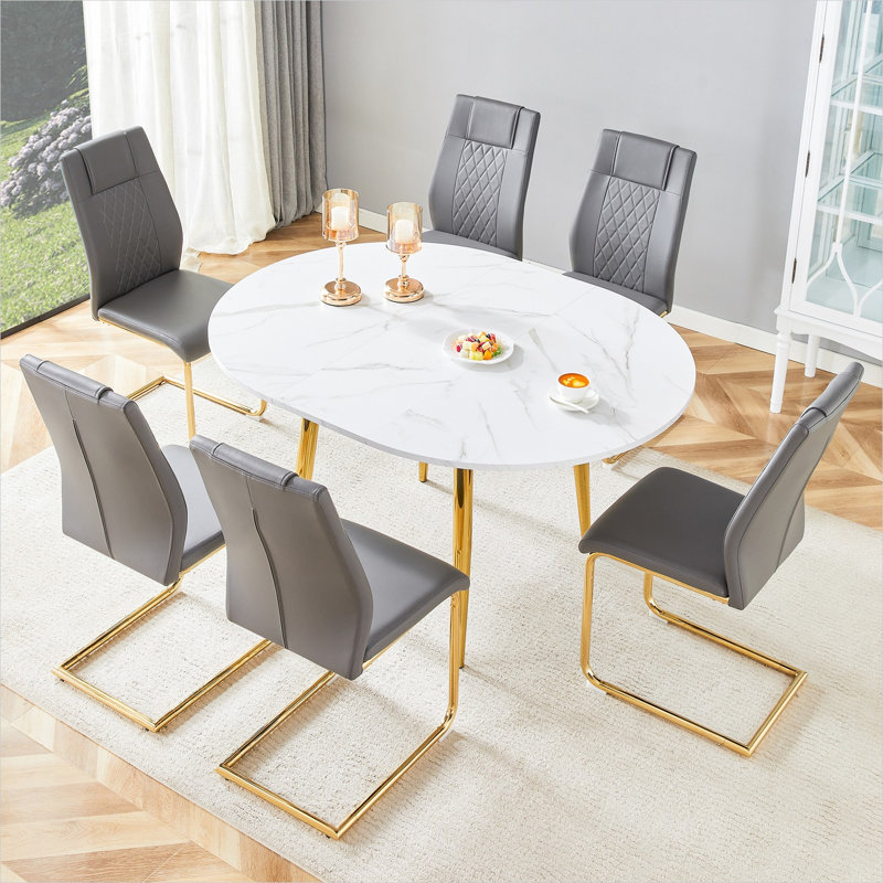 Ensemble de salle à manger rond extensible pour 6 personnes avec chaises gris neutre et table en bois aggloméré blanc, pieds en métal doré