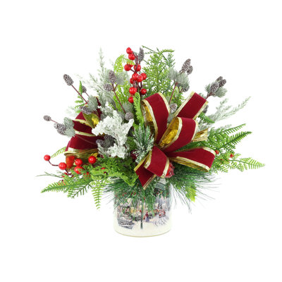 Festive holiday arrangement with greens and Berries