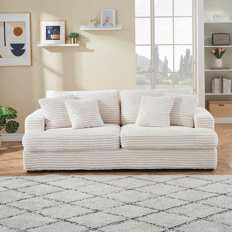 Spacious and Comfortable Corduroy 3 - Seater Sofa with Four Throw Pillows, Perfect for a Relaxing Modern Living Room Experience