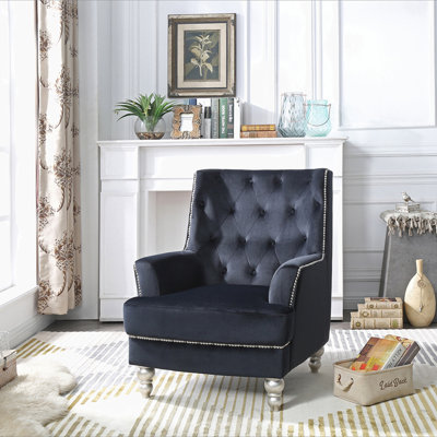 Charmant fauteuil traditionnel à accoudoirs ronds