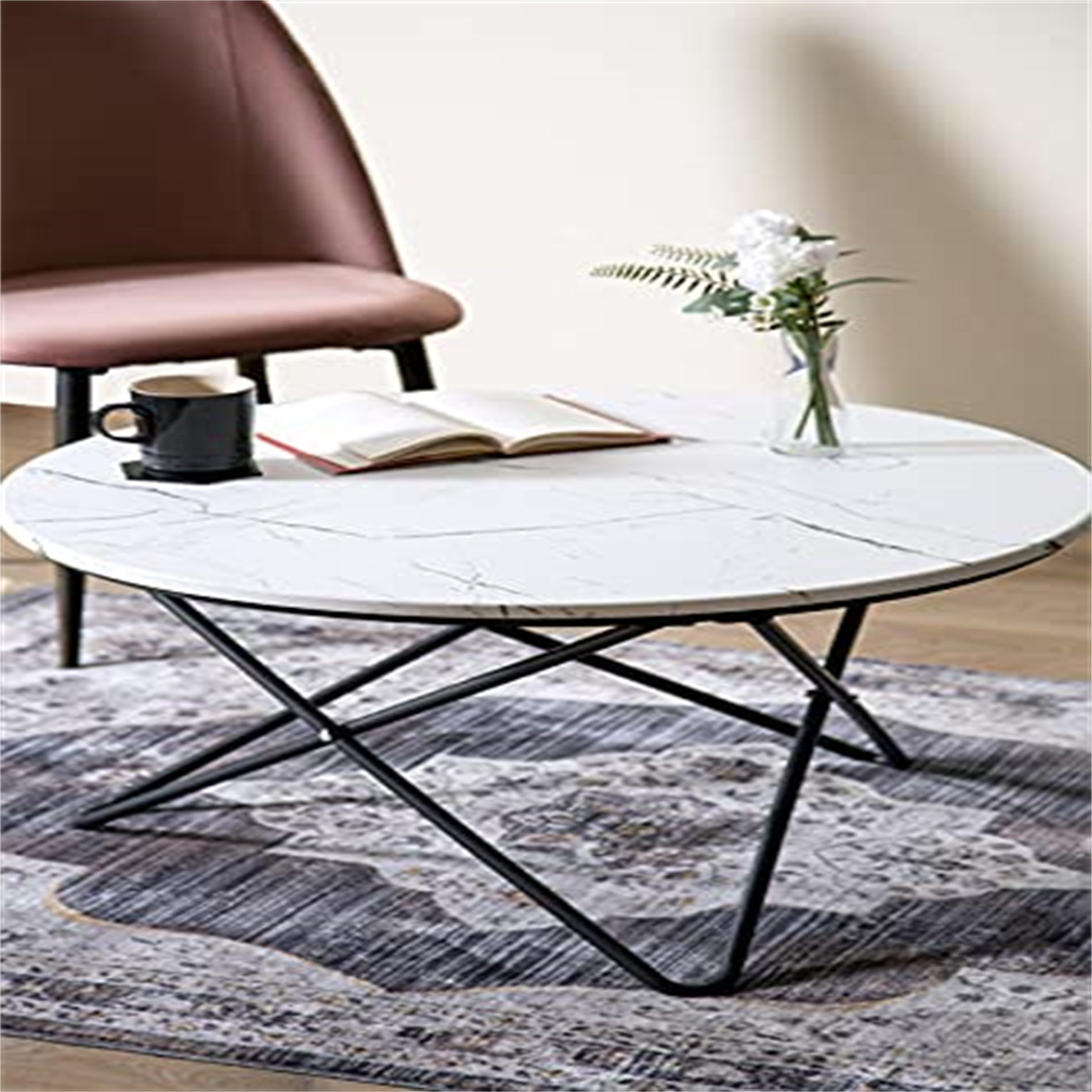 Round marble coffee table deals with black legs