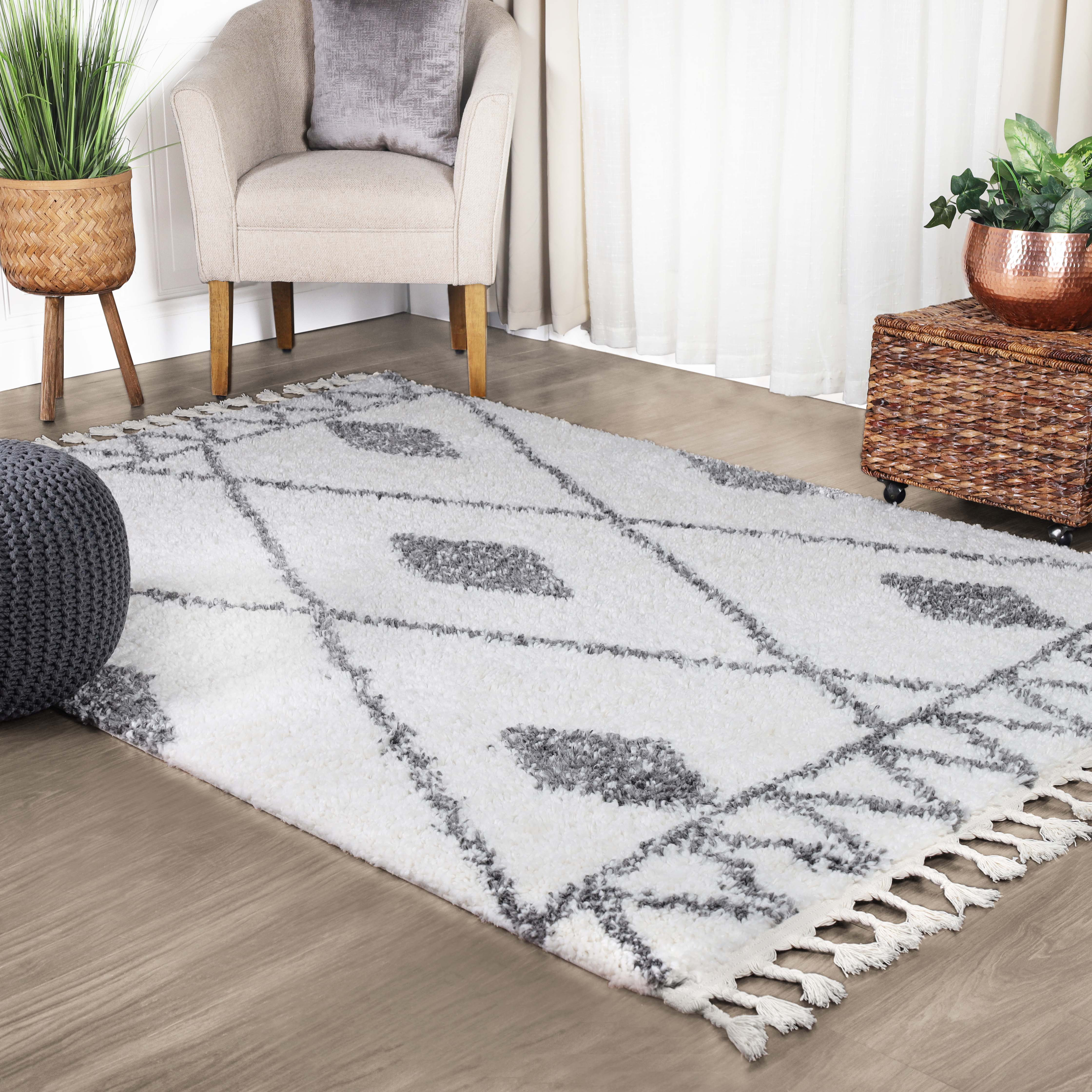 https://assets.wfcdn.com/im/46148433/compr-r85/2525/252533225/boho-tribal-geometric-indoor-shag-area-rug-with-tassels.jpg