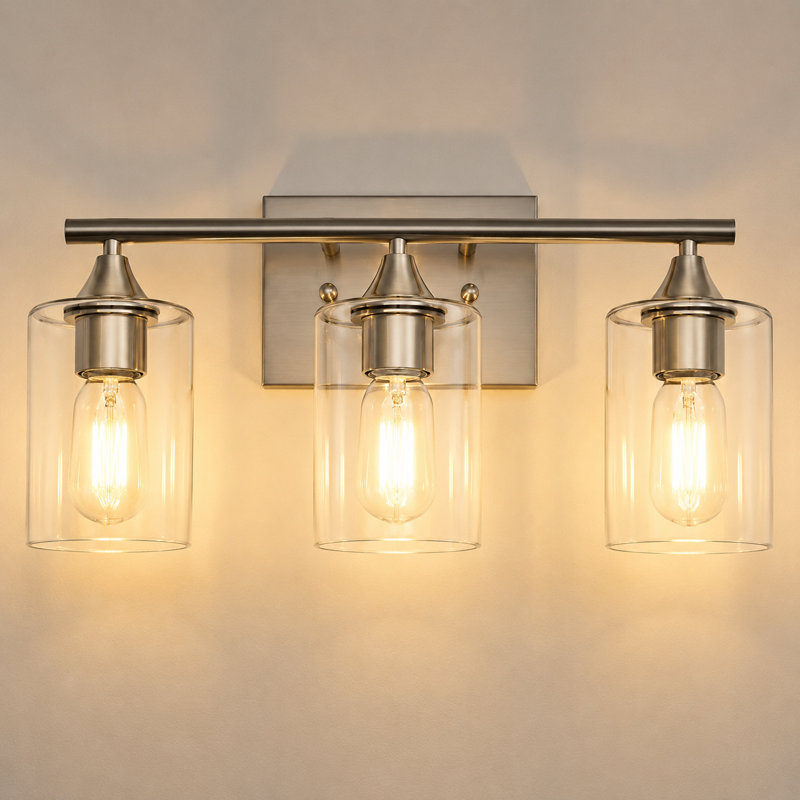 Éclairage pour salle de bain 3 lumières en nickel brossé avec abat-jour en verre transparent et fixation murale réversible, 3