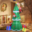 Père Noël grimpant à un arbre gonflable