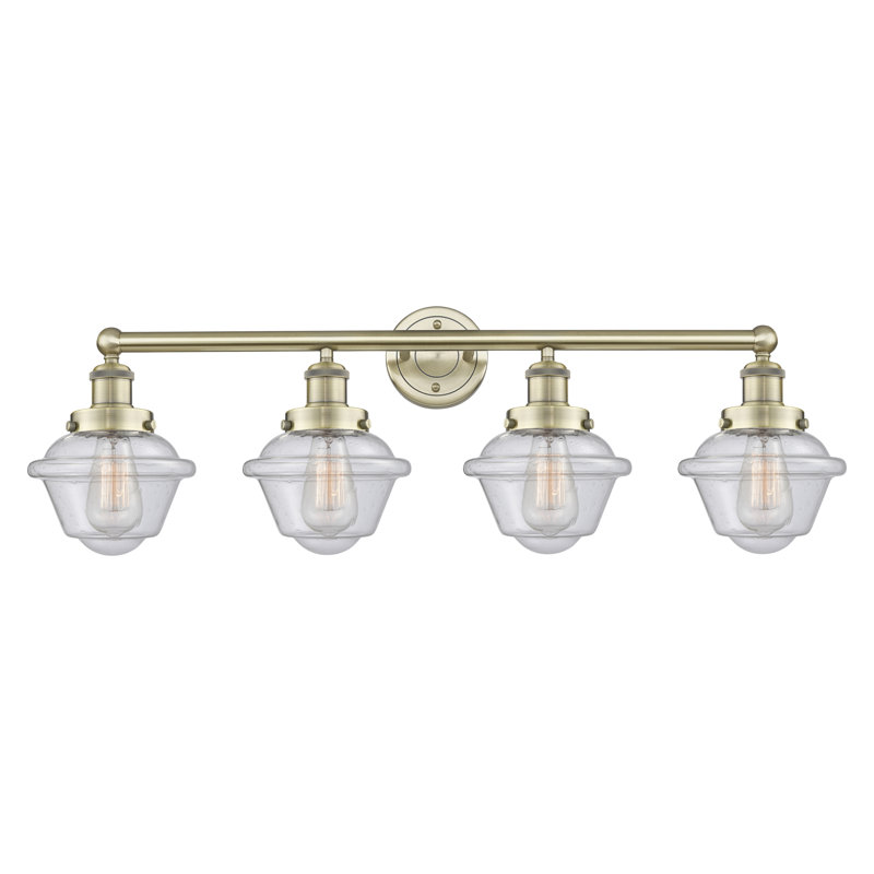Éclairage pour meuble-lavabo à 4 lumières à intensité variable Grourke, Bullé, Antique Brass