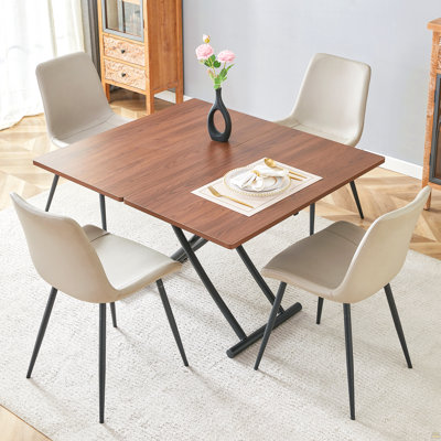 Table And Chair Set.Modern Multifunctional Lifting Platform,Walnut Wood Grain Sticker MDF Desktop, Black Metal Legs.Paired With 4 Warm Gray Artificial PU Chairs With Curved Widened Cushion Design.