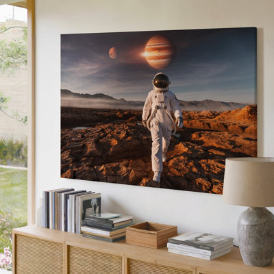 Canvas A Lone Astronaut Encased In A Pristine White Space Suit Wall Art That Gleams Under The Distant Sun Strides Purposefully Across Canvas Wall Art