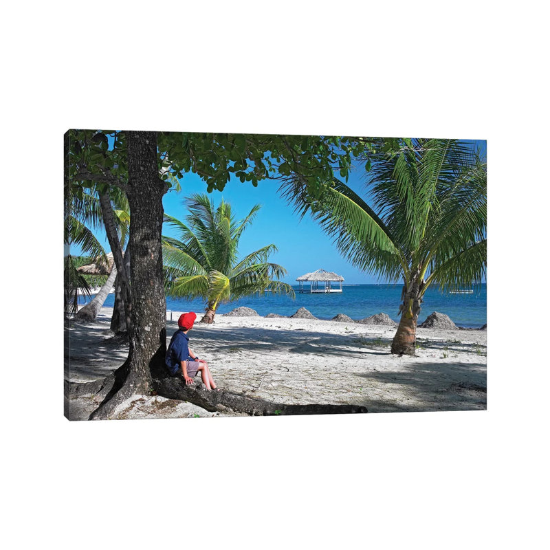Tourist Resting Under Palm Trees On Beach At Palmetto Bay, Roatan Island, Honduras by Tim Fitzharris - Wrapped Canvas Print