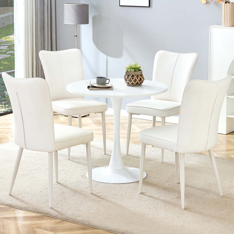 Ensemble de table et de chaises. Petite table ronde stable en forme de verre - avec 4 chaises de salle à manger avec une ligne verticale sur le dossier