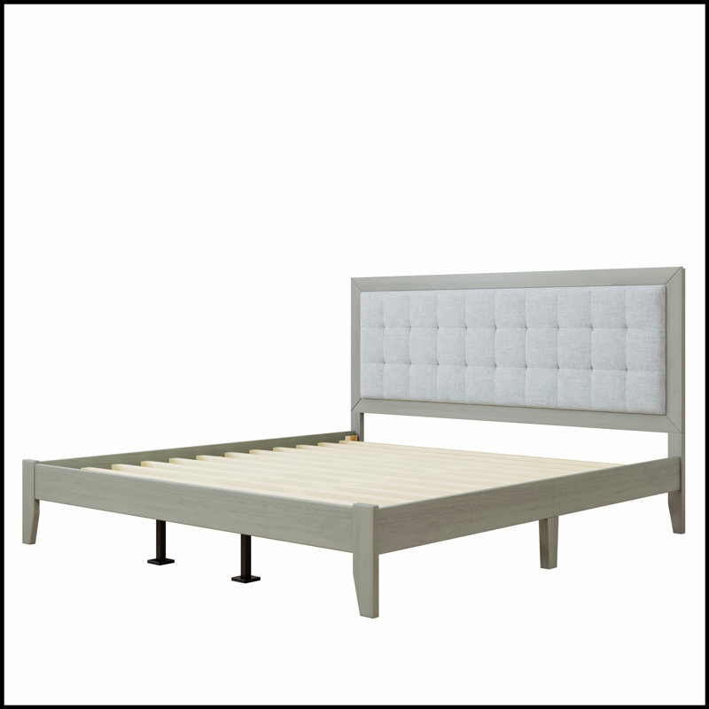 Lit plateforme en bois massif avec tête de lit rembourrée pour le confort et la durabilité, parfait pour les chambres à coucher modernes.