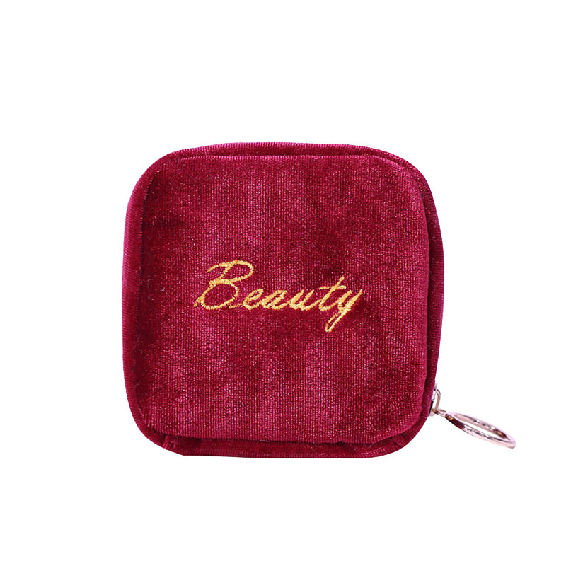 La fermeture à glissière du mignon et super petit sac de poignet contient du rouge à lèvres, Red
