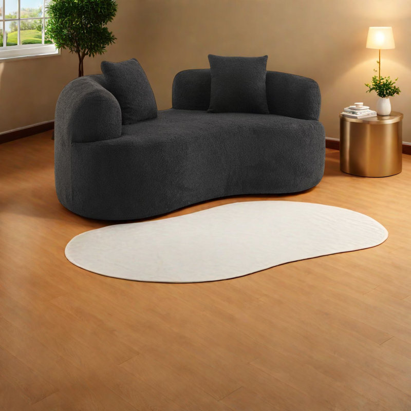Causeuse compacte en velours noir, moderne pour les petits espaces