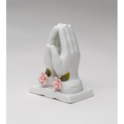 Figurine priant avec une rose