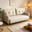 Ce canapé double beige moderne est doté d'une structure en bois massif robuste et de coussins confortables, ce qui le rend idéal pour les couples qui se détendent à la maison.