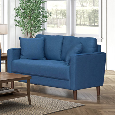 Causeuse contemporaine en tissu bleu avec coussins rembourrés et moelleux capitonnés