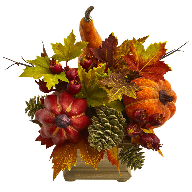 Arrangement de fleurs mélangées à feuilles en pot