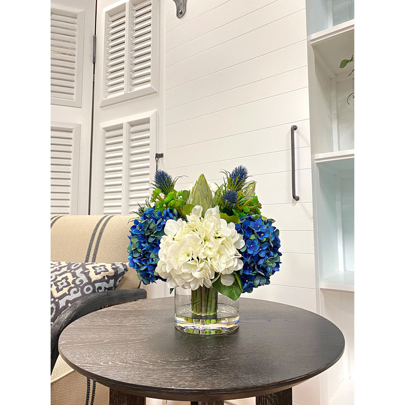 Assorted Hydrangeas with Thistle, Cactus and Protea in Glass Vase