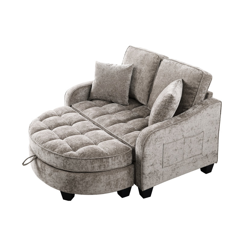 Chaise longue double en brun, avec un design irrégulier, une assise confortable et un repose-pieds caché en velours côtelé brun à deux places avec coussins incurvés,