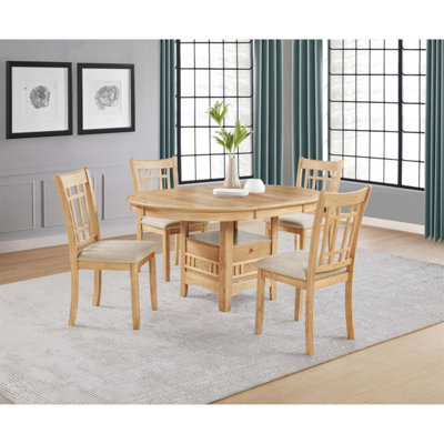 Ensemble de salle à manger cinq pièces en chêne clair avec rallonge et rangement, parfait pour des repas de famille conviviaux et pour recevoir des invités.