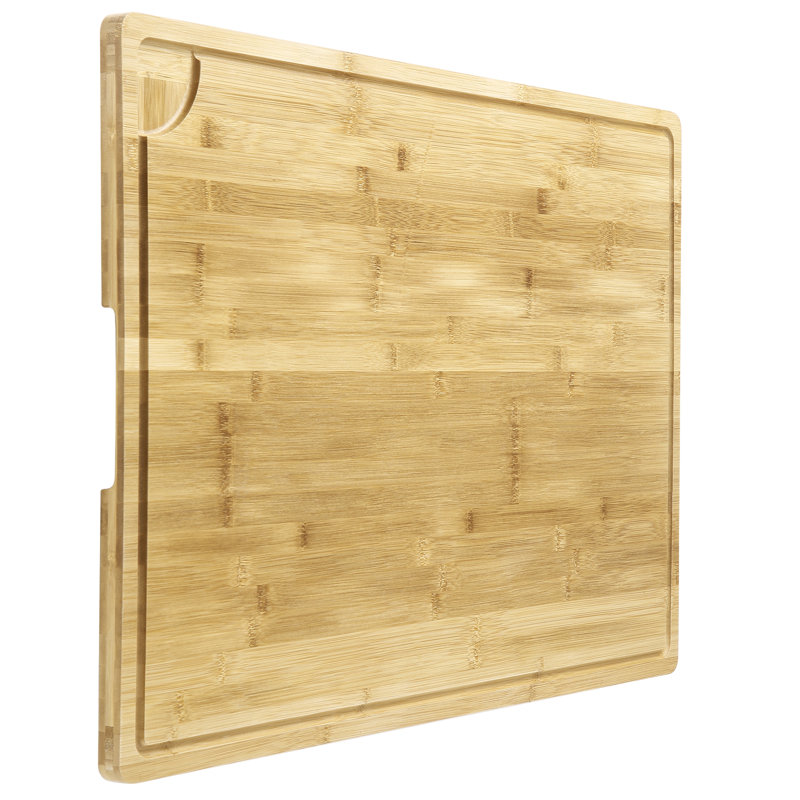 Natural bamboo cutting board with an integrated juice groove and corner pour spout