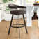 Robinett Swivel Counter or Bar Height Bar Stool with Arms and Footrest in Faux Leather and Metal