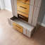 Commode dorée en bois gris