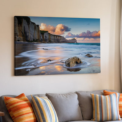 Canvas A Serene Coastal Scene At Sunset Featuring Dramatic Cliffs Rising Wall Art Majestically In The Background Their Rugged Textures Canvas Wall Art