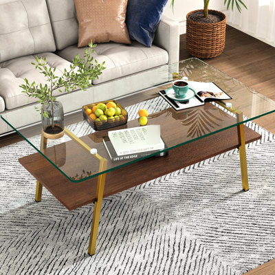 Table basse moderne et transparente avec pieds en métal stables et panneau en verre au design élégant