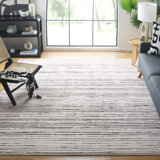 Tapis ivoire / noir en polyester tissé à la machine Simrita