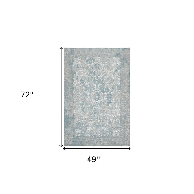 Tapis médaillon gris et ivoire 4 pi x 6 pi