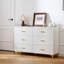 Commode 6 tiroirs blanche avec poignées dorées et pieds en métal