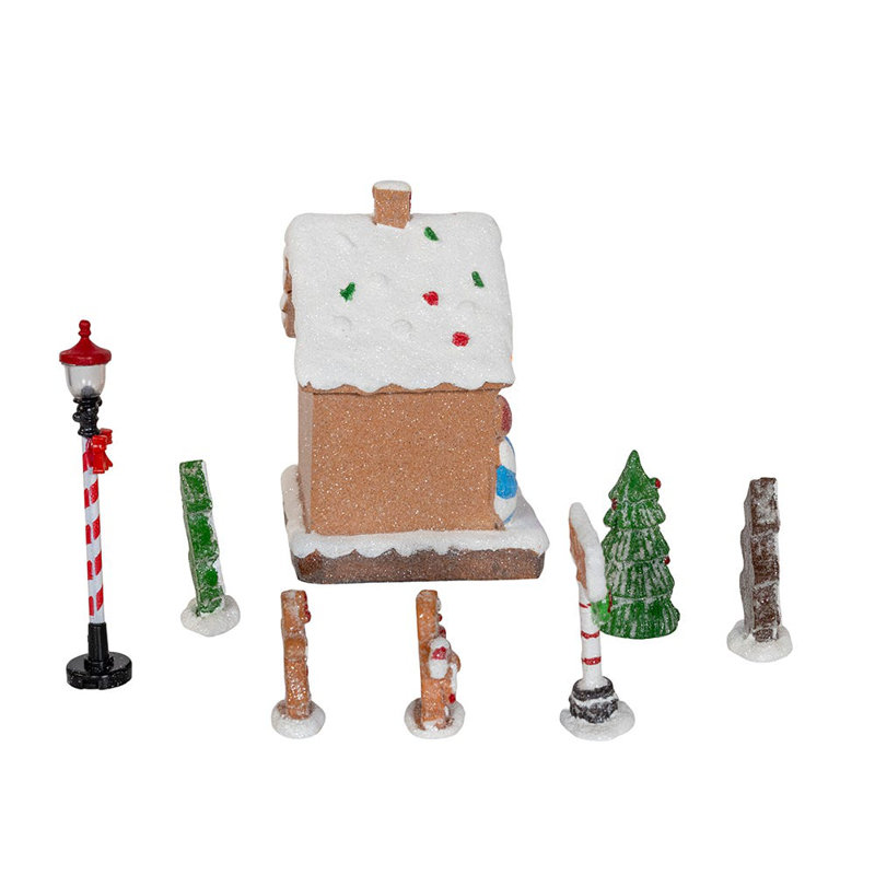 Cet ensemble de maison en pain d'épices à DEL multicolore à piles de Kurt Adler