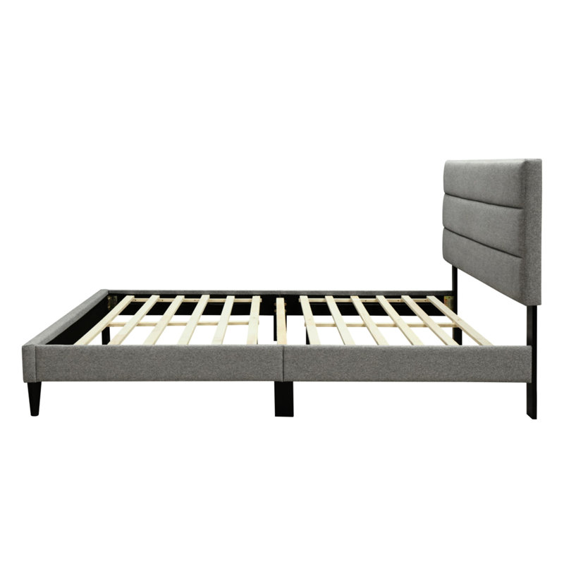 Grand lit gigogne dans une boîte avec tête de lit grise en tissu