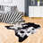 Ganote Animal Print Faux Cowhide Area Rug-584485137-649386223
