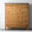 Armoire en bois sculpté, portes en verre et métal