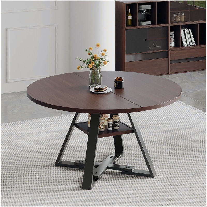 Round dining table in black walnut, 115cm.