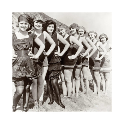 " 1920s Group of Smiling Women Wearing One Piece Bathing Suits and Caps Posing Lined Up on Beach Looking at Camera " Black and White Photography