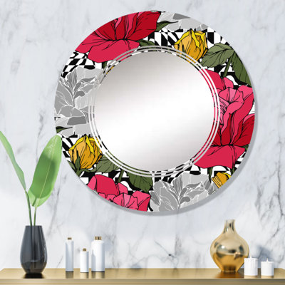 Miroir mural rond rouge et jaune à motif de fleurs tropicales sur fond noir et blanc