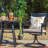 Argyri 6-Person Powder Coated Steel Patio Dining Set with Round Table and Cushions