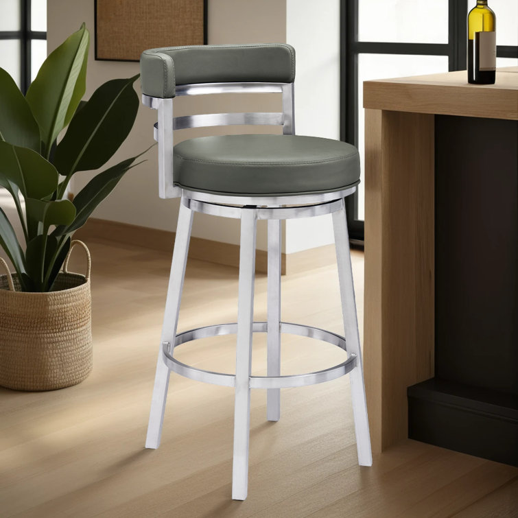 Deherrera Modern Swivel Counter or Bar Stool with Open Low Back and Footrest in Metal and Faux Leather