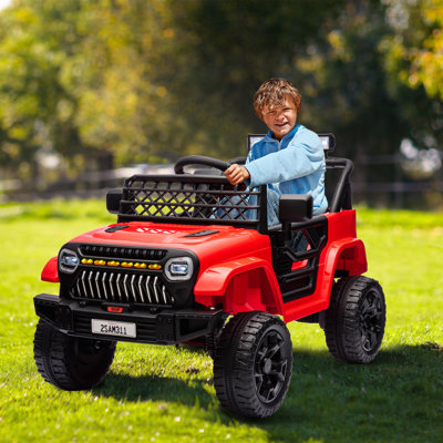 Les enfants de 12 V montent sur un véhicule électrique à piles avec des jouets pour enfants