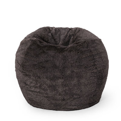 Pouf rond de 90 cm en fausse fourrure marron/beige. Siège confortable. Housse amovible zippée. Garnissage en mousse haute densité. Pieds ronds. Décoration intérieure moderne.