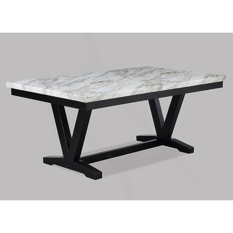 Table de salle à manger rectangulaire élégante avec tréteaux en forme de V et base en bois pour une expérience de salle à manger sophistiquée.