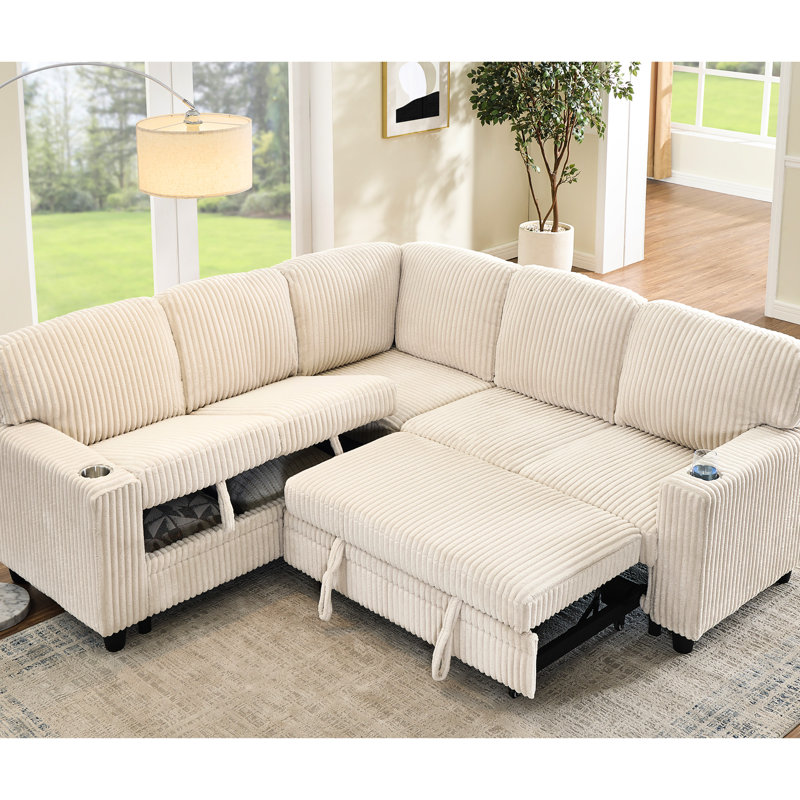 Lit de coin en velours côtelé beige avec lit gigogne, rangement dissimulé et prise de recharge pour les invités. Convertible avec 5 prises intelligentes et revêtement en tissu doux.