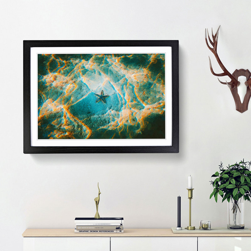 A Starfish on the Ocean Floor - Picture Frame Graphic Art Print, 62cm H x 87cm W x 2cm D, Black Framed