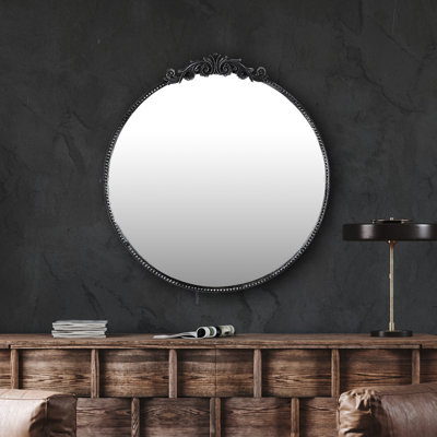 Miroir mural rond orné d'inspiration baroque